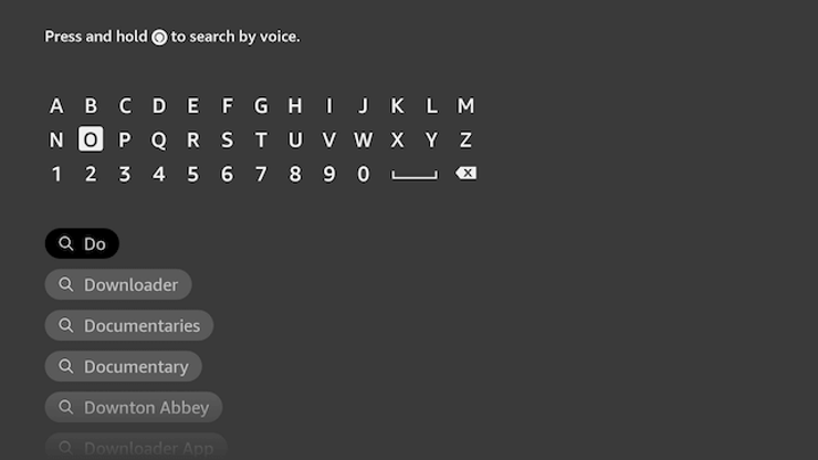 User search bar to type in Downloader on Firestick